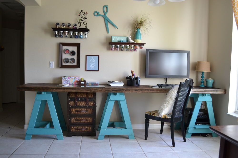 Craft room sawhorse desk with blue base