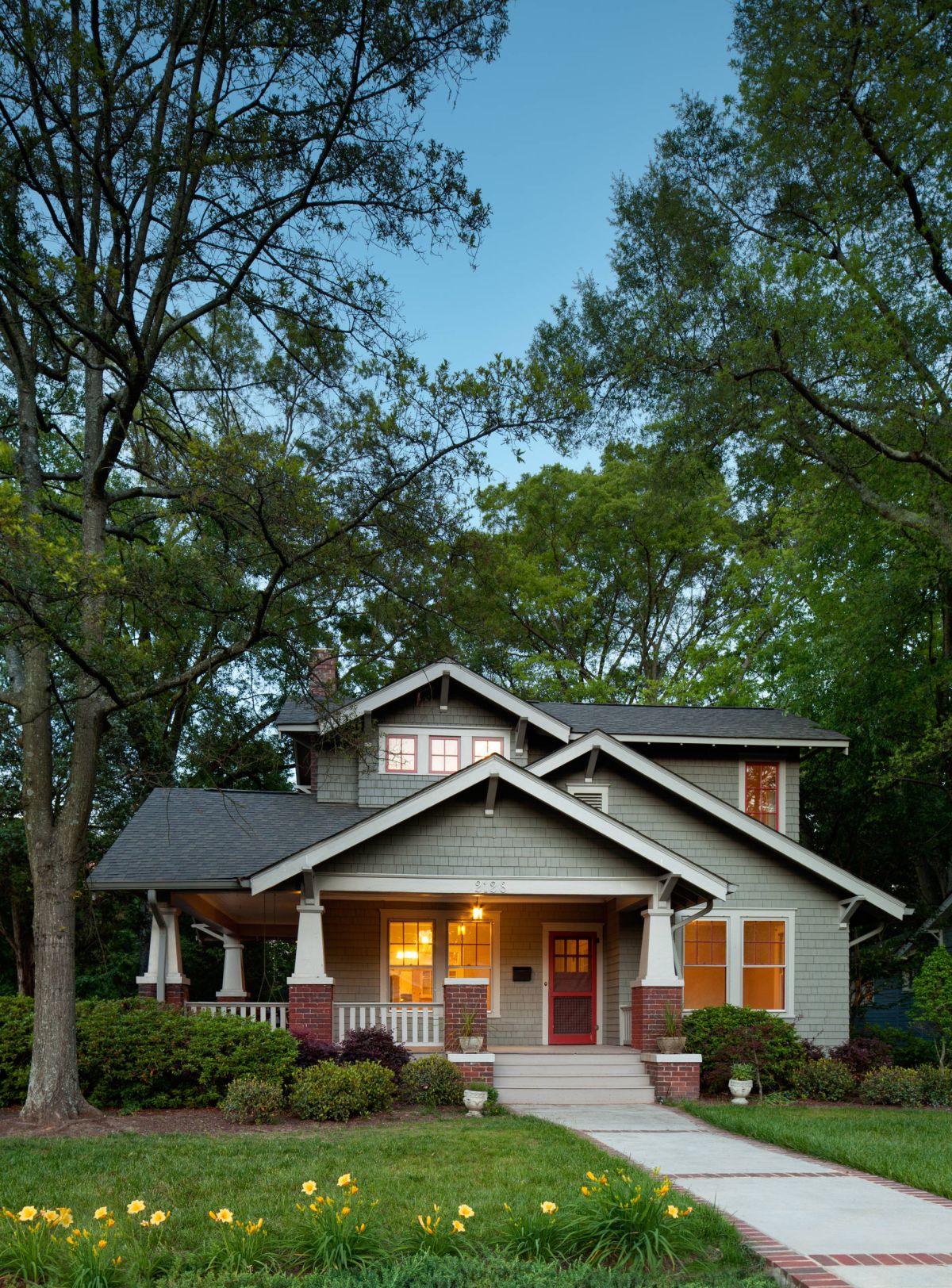 Craftsman exterior green shingles extended porch design