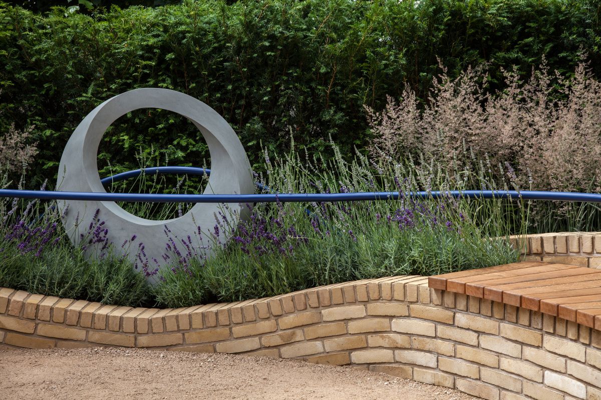 You can position the bench next to a garden sculpture or it can overlook something similar