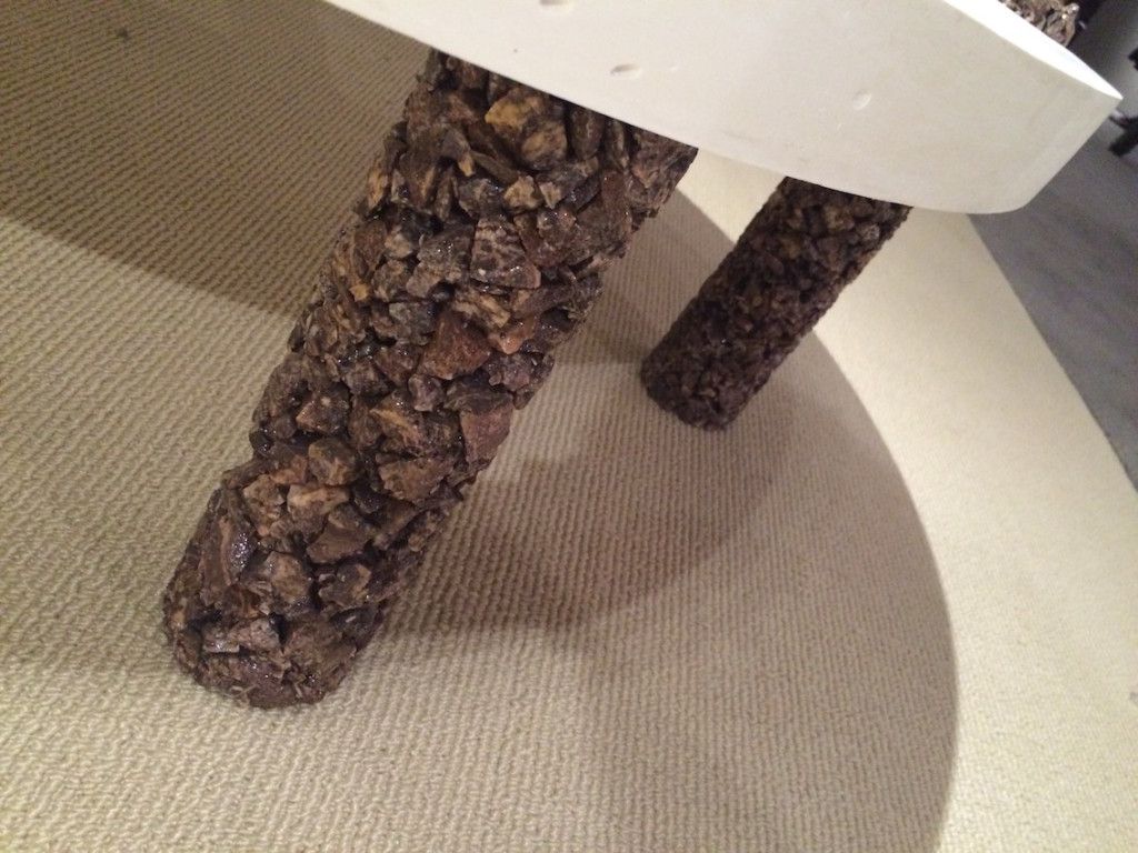 The stone coating give the coffee table legs added interest and heft.