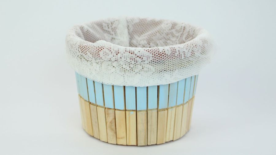 Cute storage bucket decorated with clothespins