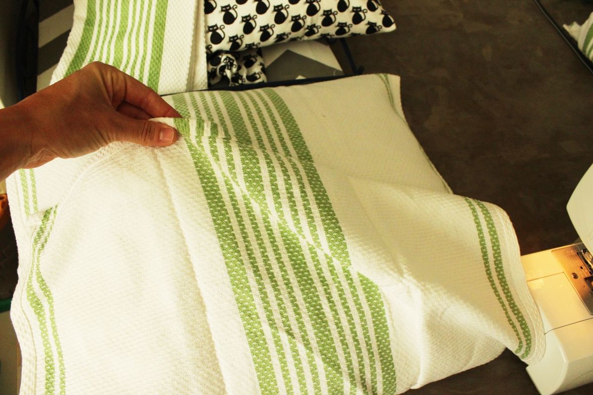 DIY Dish Towel Pillows Lay the dish towel piece right side up
