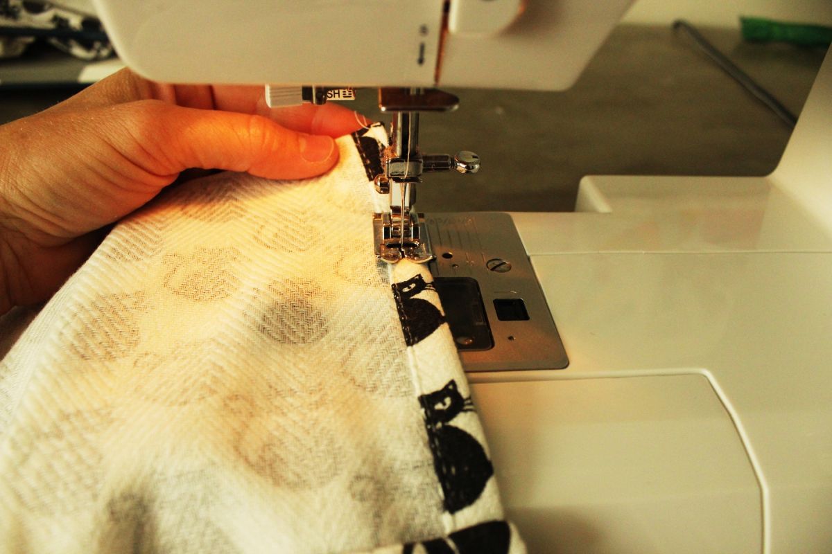 DIY Dish Towel Pillows Sew the dish towel seams in place