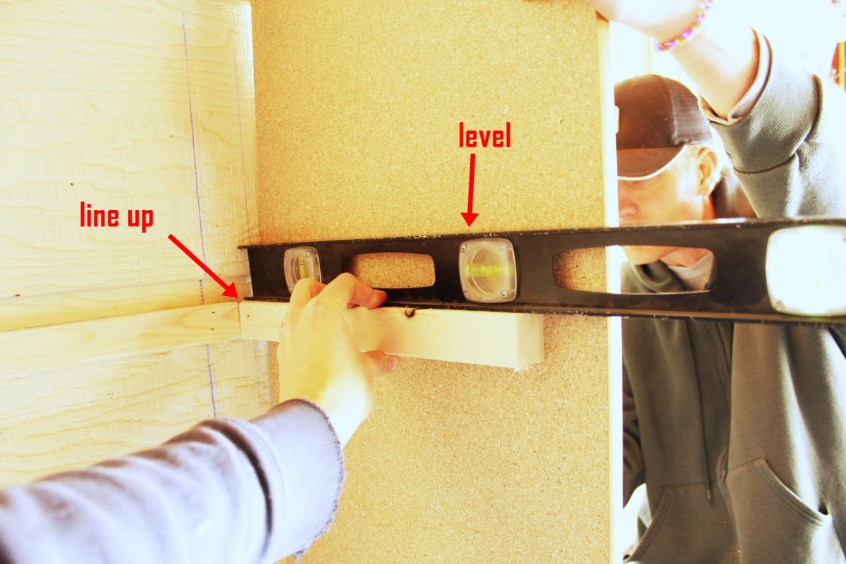 DIY Easy Built in Shelves Press the side shelving board flush against