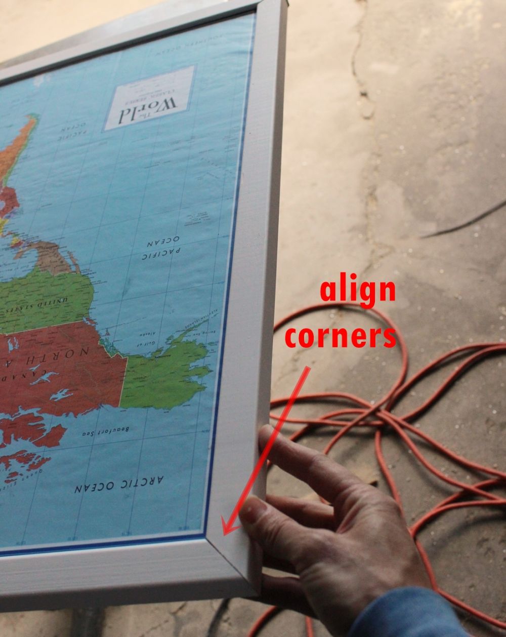 DIY Framed Map Corkboard - top trim piece nailed