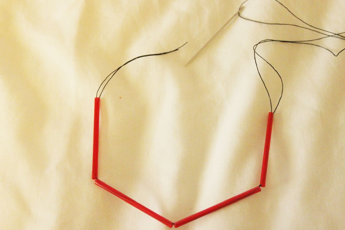 DIY Goemetric Straw Ornaments-Start by threading your needle