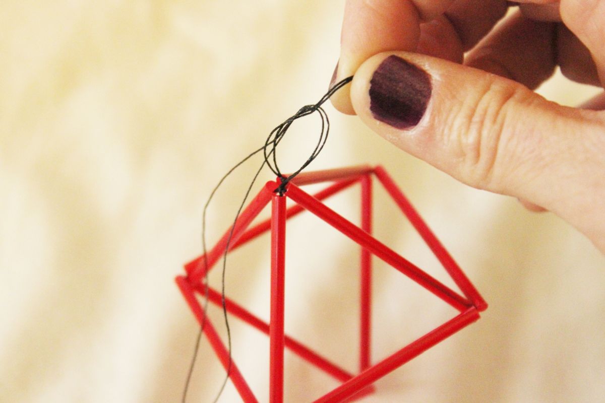 DIY Goemetric Straw Ornaments-Tie a square knot at the top of your prism