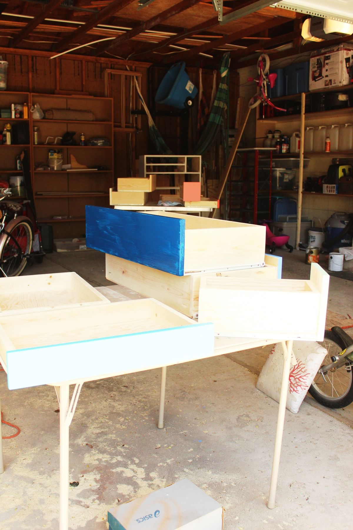 DIY Modern Wooden Dresser Give all the drawer faces two or three coats