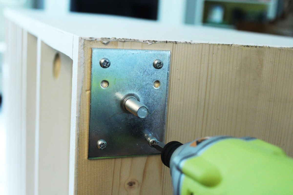 DIY Modern Wooden Dresser Install the leg plates into the corners