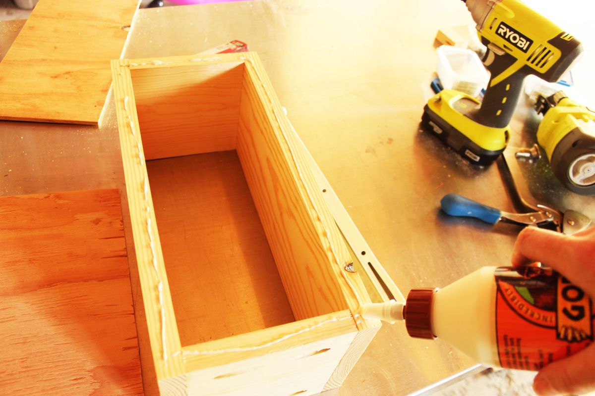 DIY Modern Wooden Dresser glue along the bottom edge of your drawer 