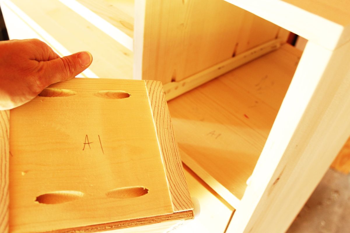 DIY Modern Wooden Dresser labeled each drawer and its correlating slot in the dresser