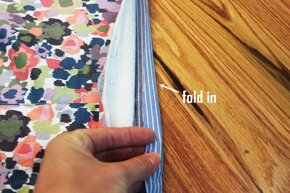 DIY Reversible Summer Quilt Begin by folding up your bottom fabric