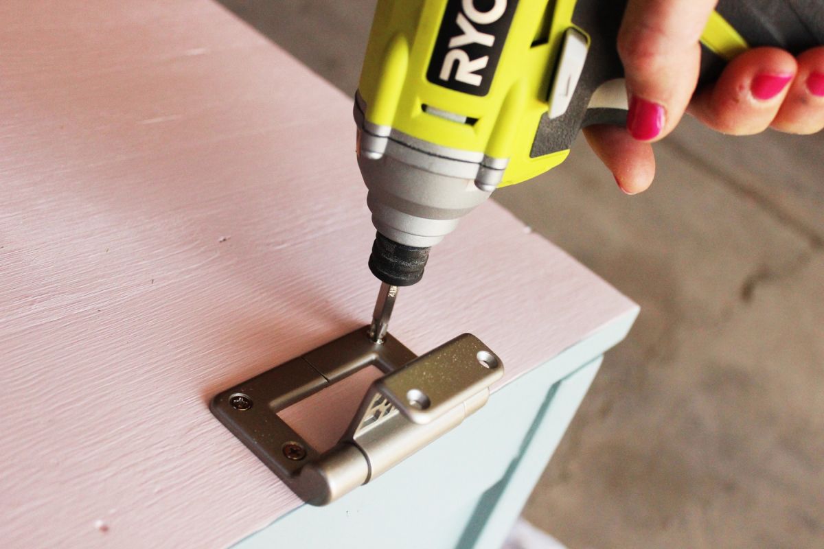 DIY Toy Box Secure the hinge to the underside
