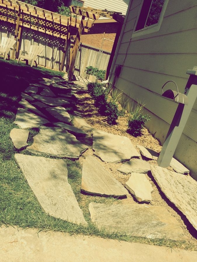 lay down the flagstone pieces for a walkway