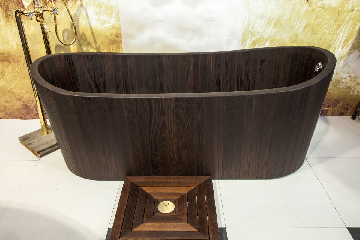 The dark color and elegant lines make this KHIS wooden bathtub a stunning addition for any style bathroom. The depth of the tub provides an excellent soaking experience.