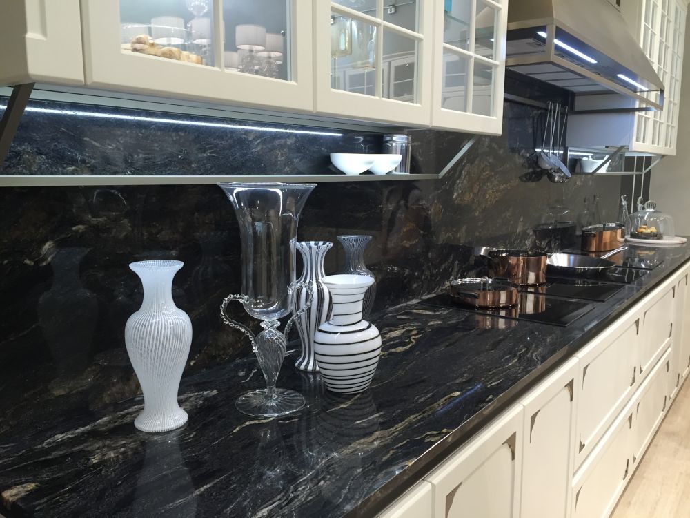 Dark kitchen marble countertop and backsplash