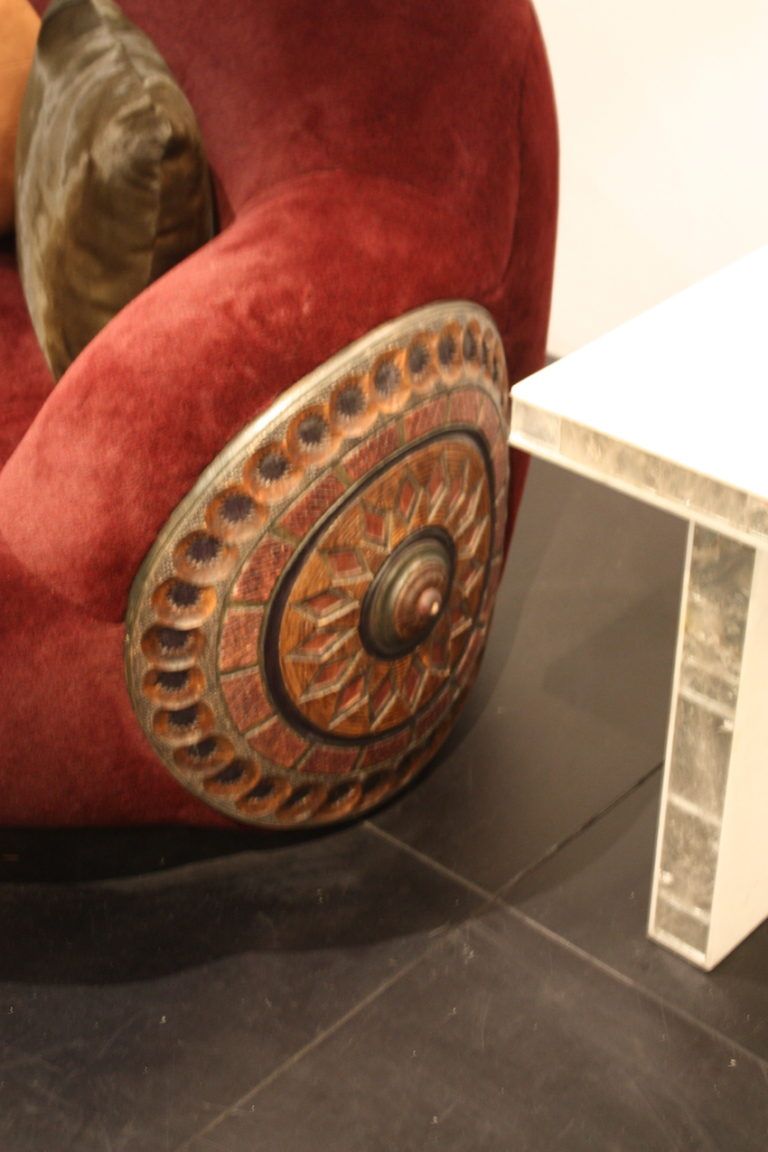 A carved medallion accents each end.