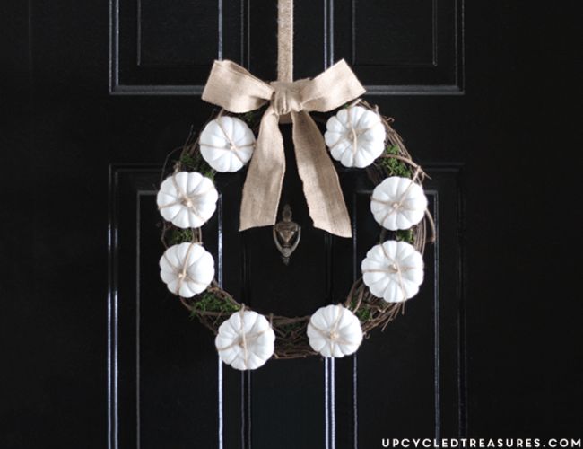 Decorate a grapevine wreath with miniature pumpkins