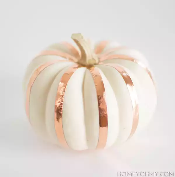 Decorate the pumpkin with tape