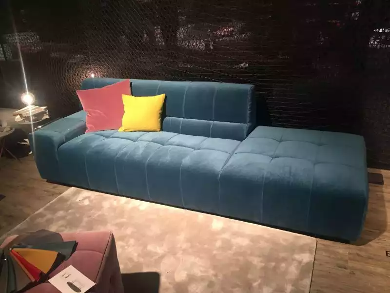 deep-blue-couch-with-decorative-pillows