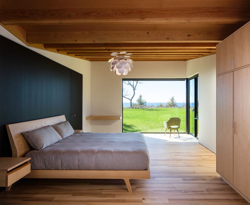 The bedroom has its own gorgeous view with adjacent windows which bring in light and color