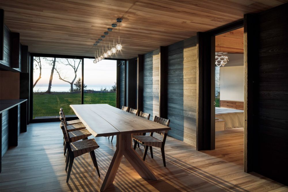 The dining room turns the view of the lake into its focal point of its decor