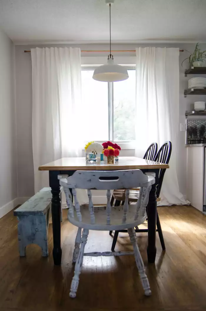 Dining area with copper curtain rods