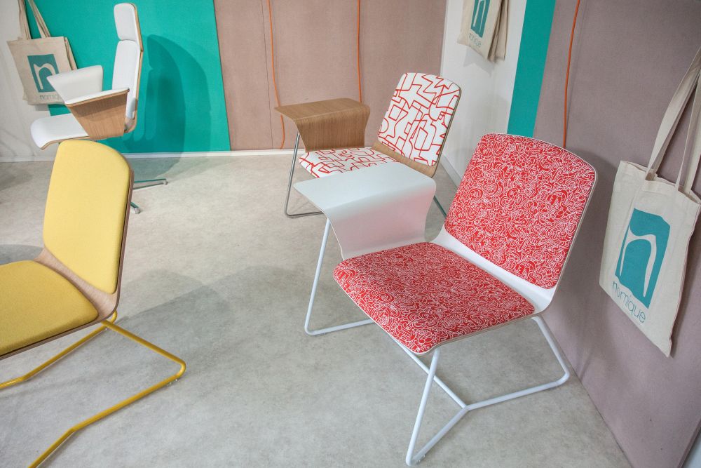 Dining chair with colorful fabric setting and hairpin legs