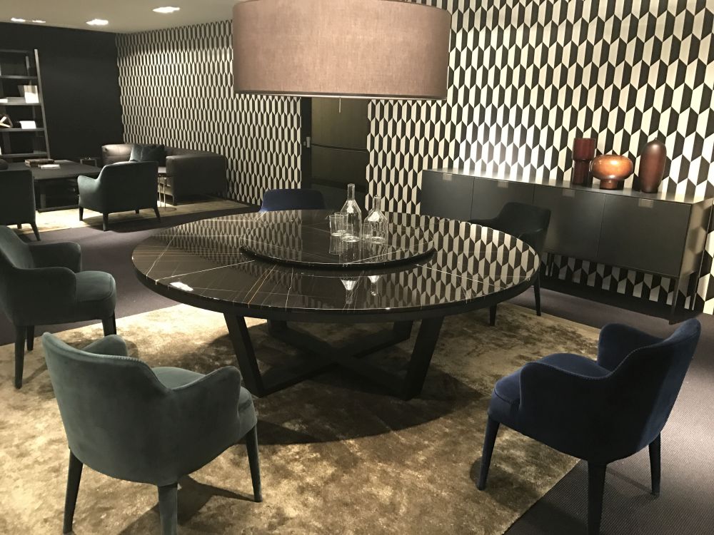 Complement a round dining table with an oversized pendant lamp that has the same shape