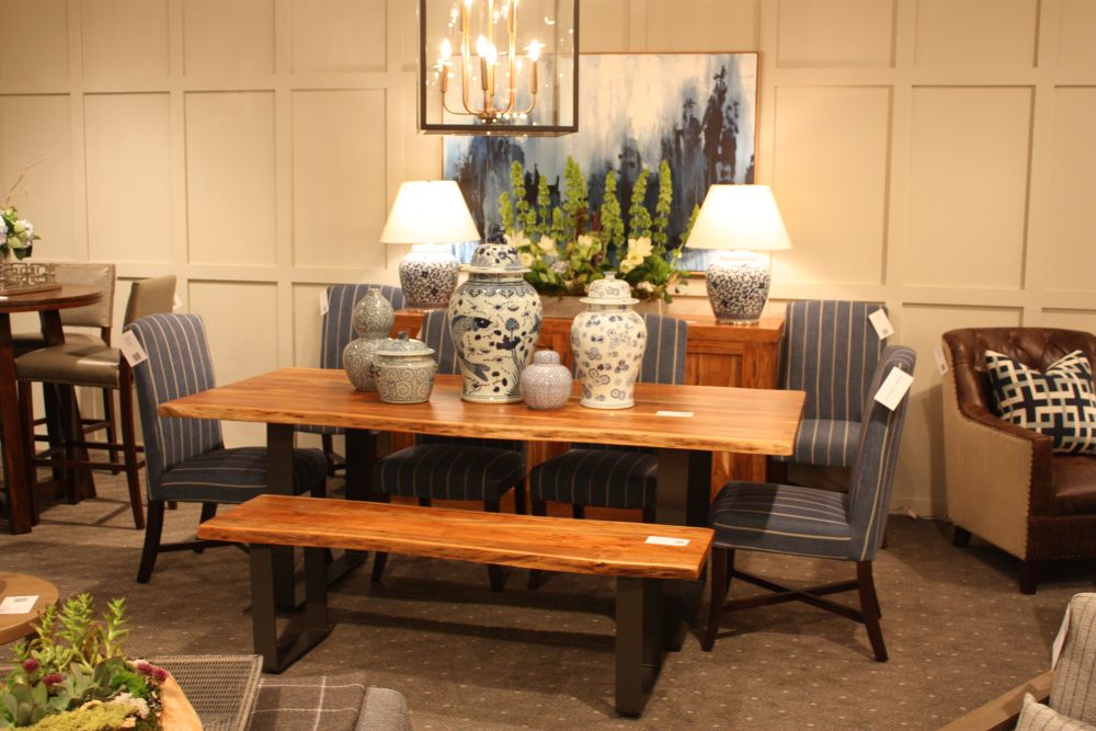Dining table with bench and ceramic large vases on the centerpiece