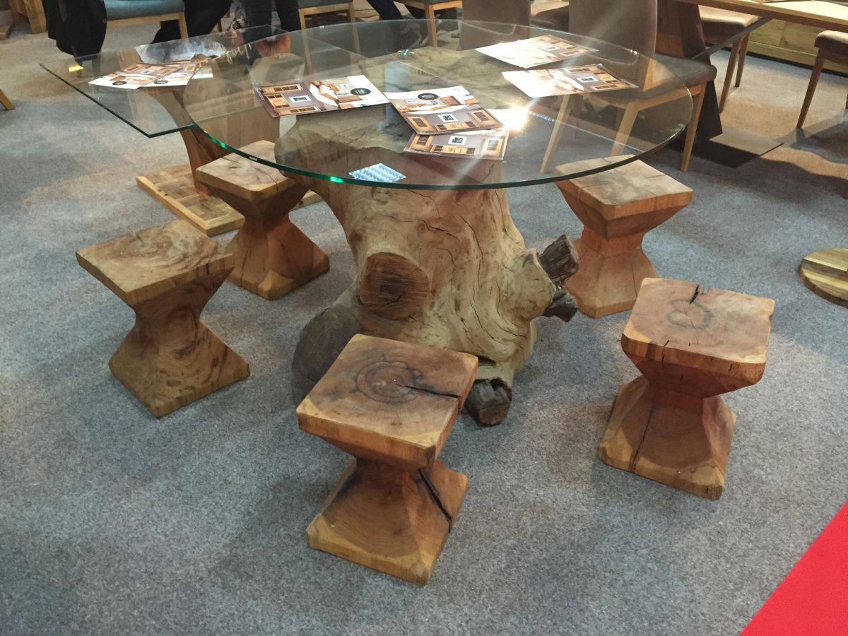 Dining table with glass top and wood tree base with stools