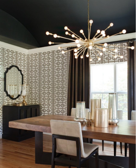 Dining with black ceiling and burst chandelier