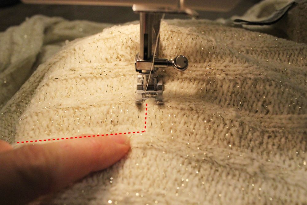 Directly outside the straight-stitch seam