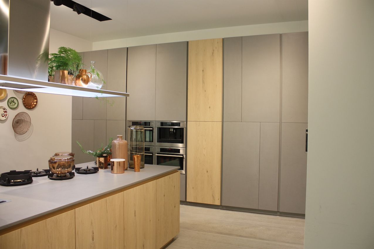 This Dolmi kitchen hides its workings behind handle-less cabinets.