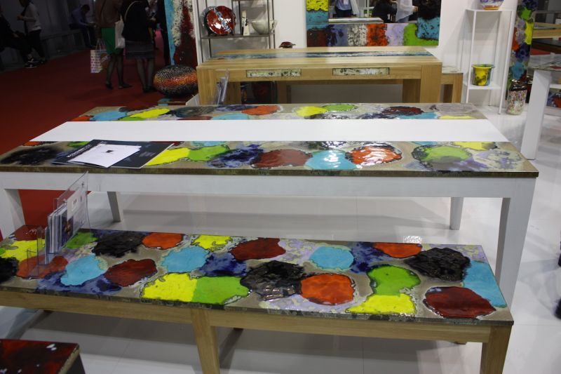 The colorfully patterned work can be made into outdoor tables, benches, chairs and accessories, as well as indoor pieces such as washbasins.