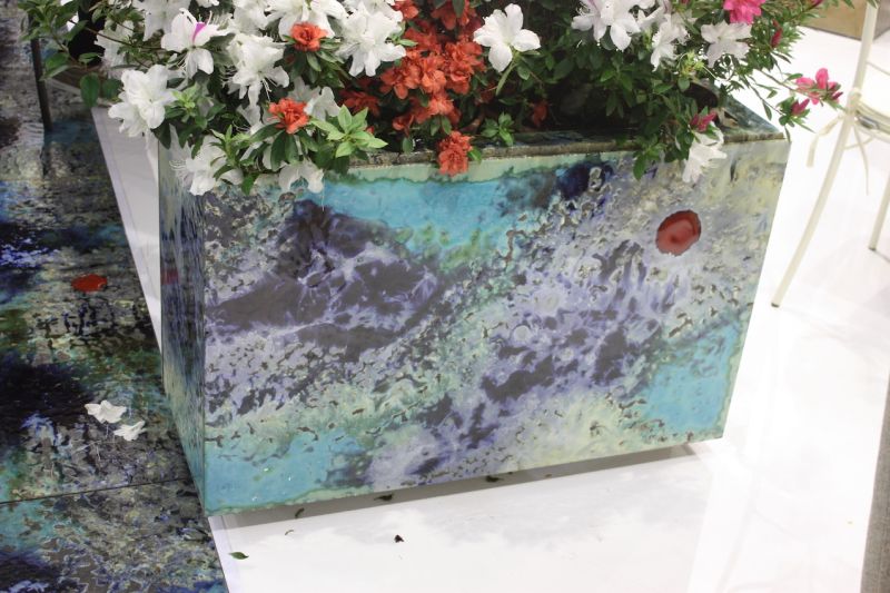 Even if your outdoor living space is already furnished, you can include colorful accessories like this planter from Domiziana. The modern, freeform pattern is perfect for just about any style of outdoor decor.