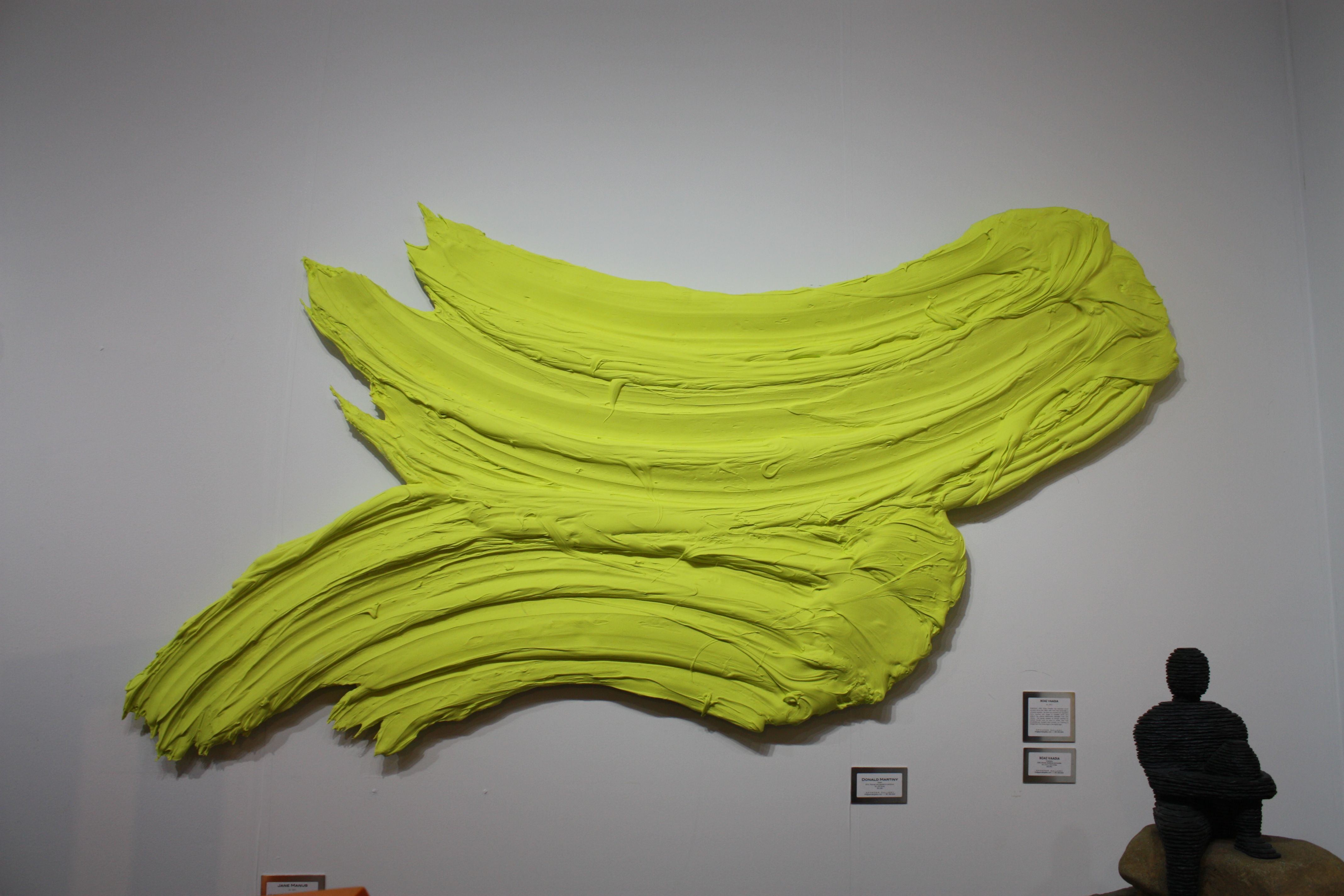 Large scale pieces are very on trend, from an abstract work like this one by Donald Martiny to simpler paintings or sculptures -- it's all up to your personal preference.