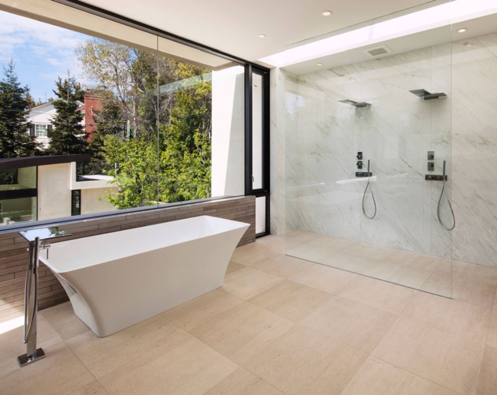 Double walk in shower with a thin glass wall