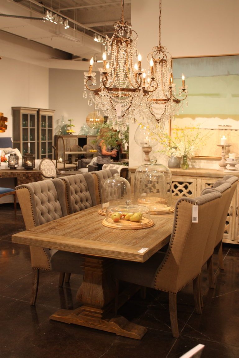 The traditional vibe is softened by the shabby chic chandelier.