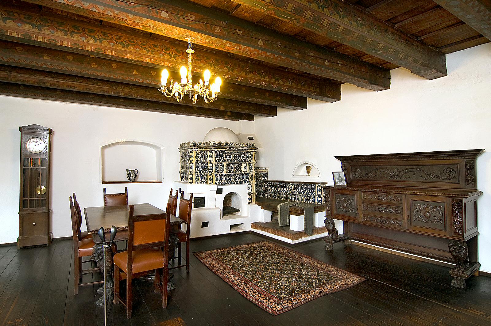 Ornamental motifs are carved out in the furniture or painted on the massive ceiling beams