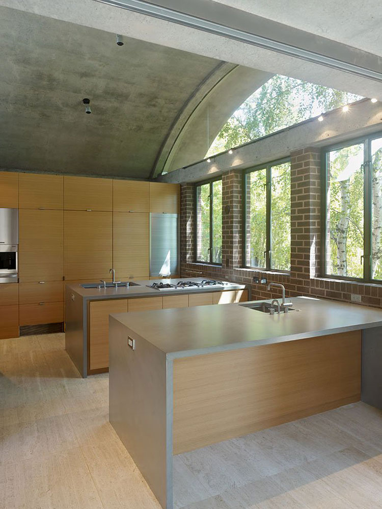 Dual kitchen island design with cement countertops