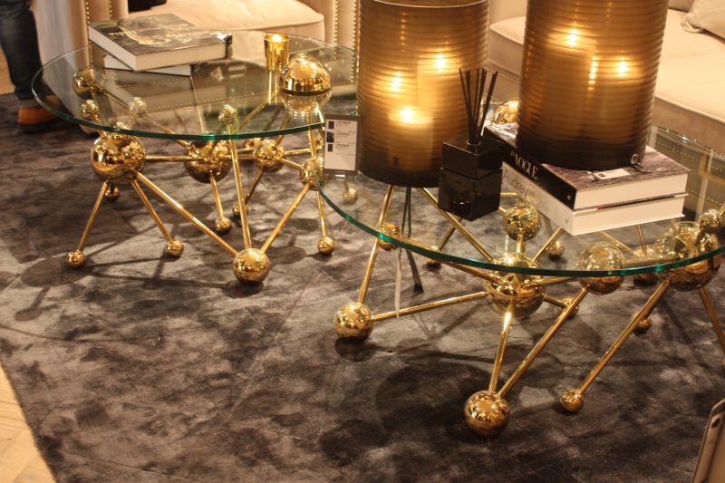 A luxurious tangle of balls and bars, the Galileo coffee table by Eichholz is made of a glass top and gold-finished base. The same style is also available as a console table and a desk.