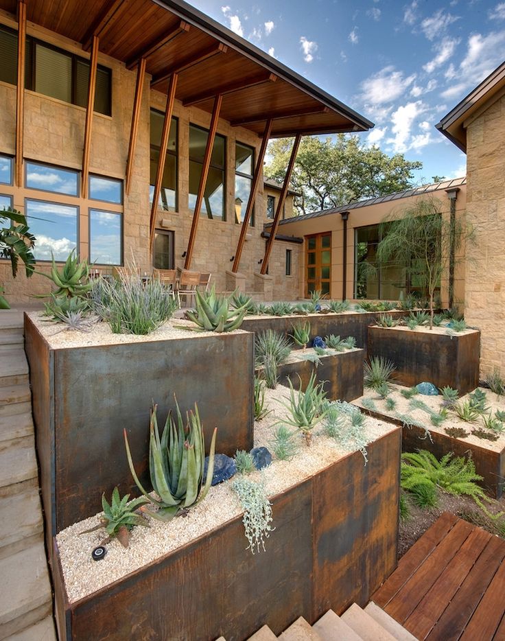 Elevated corten steel planters for backyard