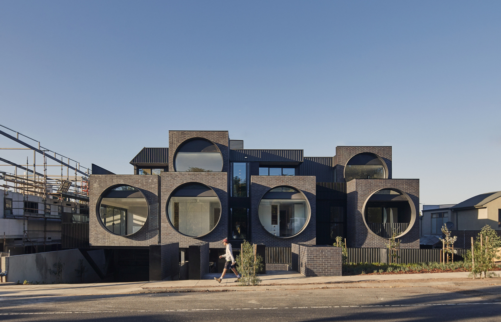 Enormous Glass Portholes Dot This Australian Apartment Building