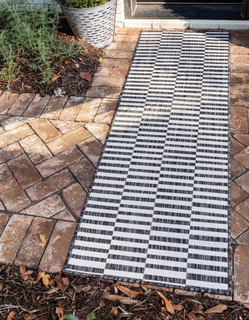 Entryway striped black and white carpet