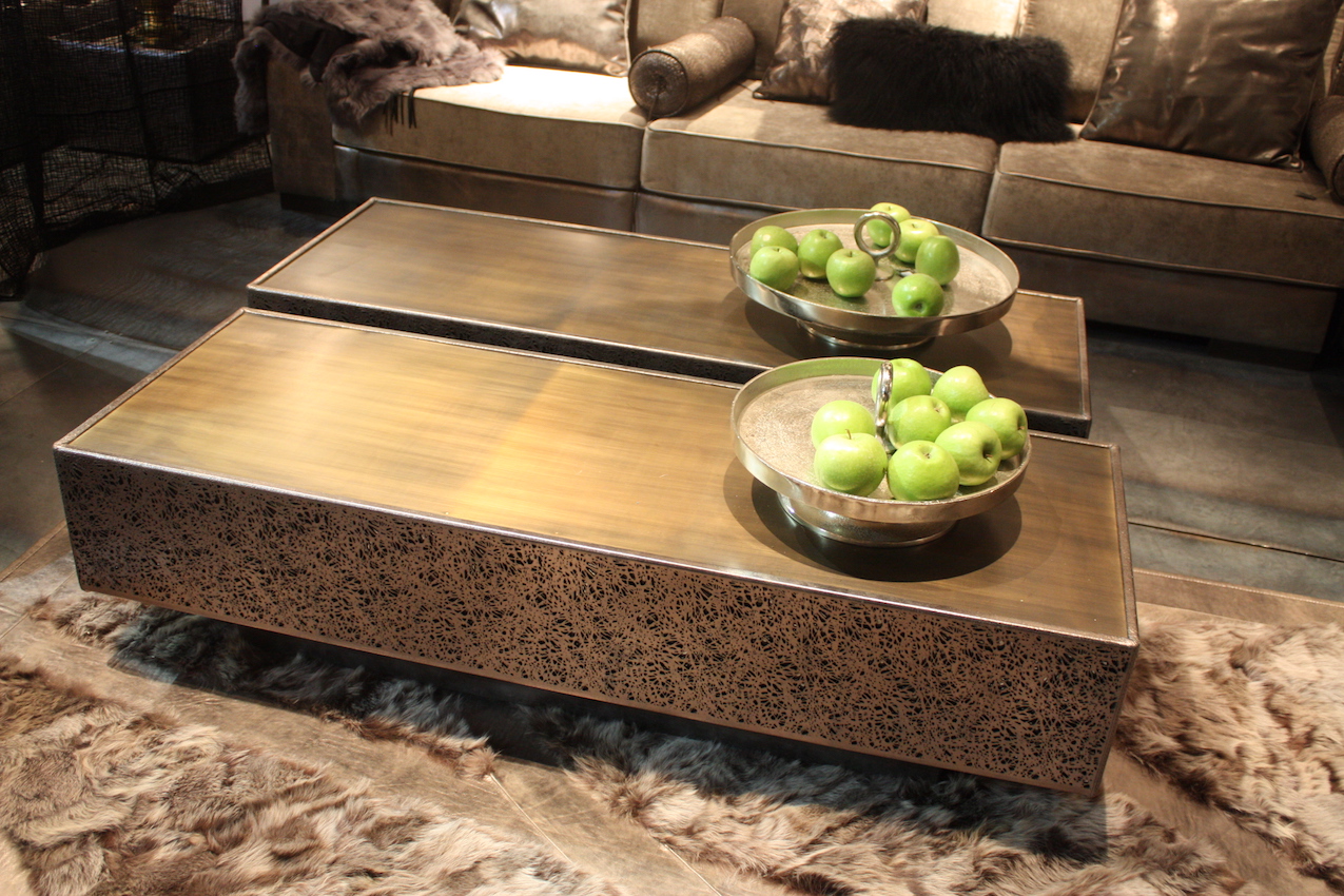 If you're in love with a rectangular coffee table but need a larger square one for your space, why not use two? This modern coffee table from Estetik Design works well as pair because the style is clean with angles and no intricate details.