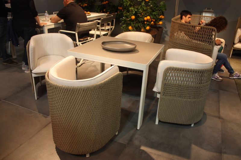 Barrel-shaped armchairs from Ethimo Outdoor Decor look so comfy we'd never want to leave the table.