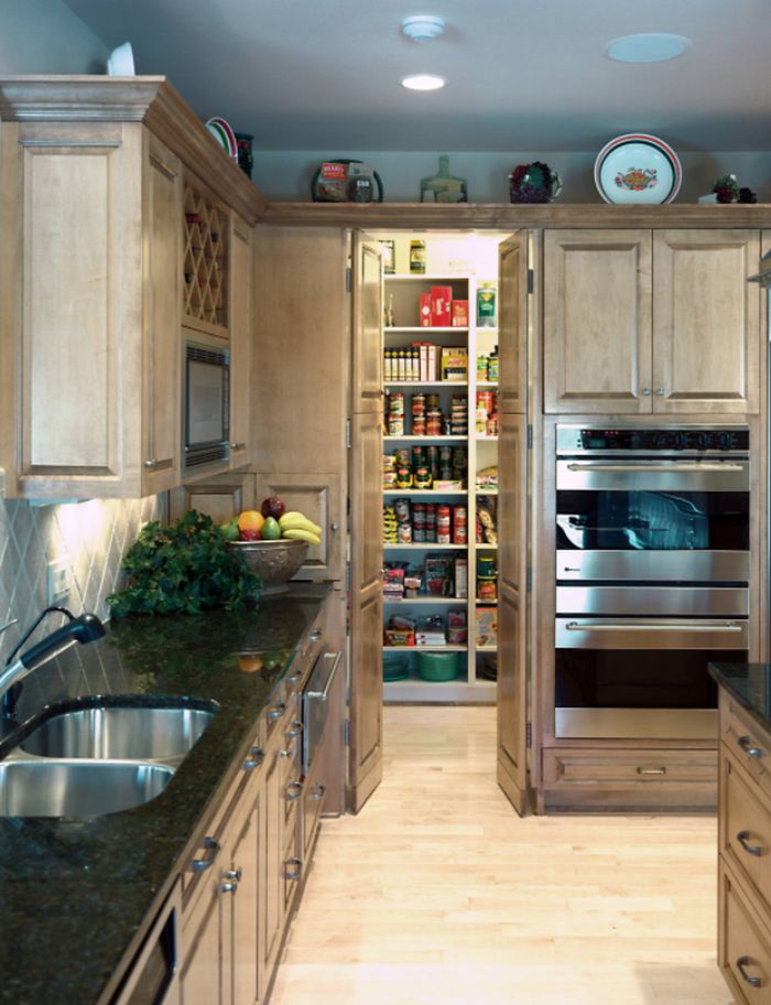 Example of a classic light wood floor kitchen design