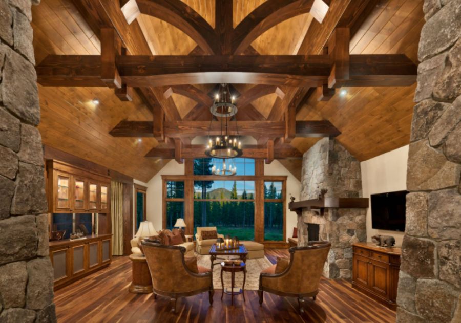 Example of a large mountain style formal and enclosed dark wood floor living room