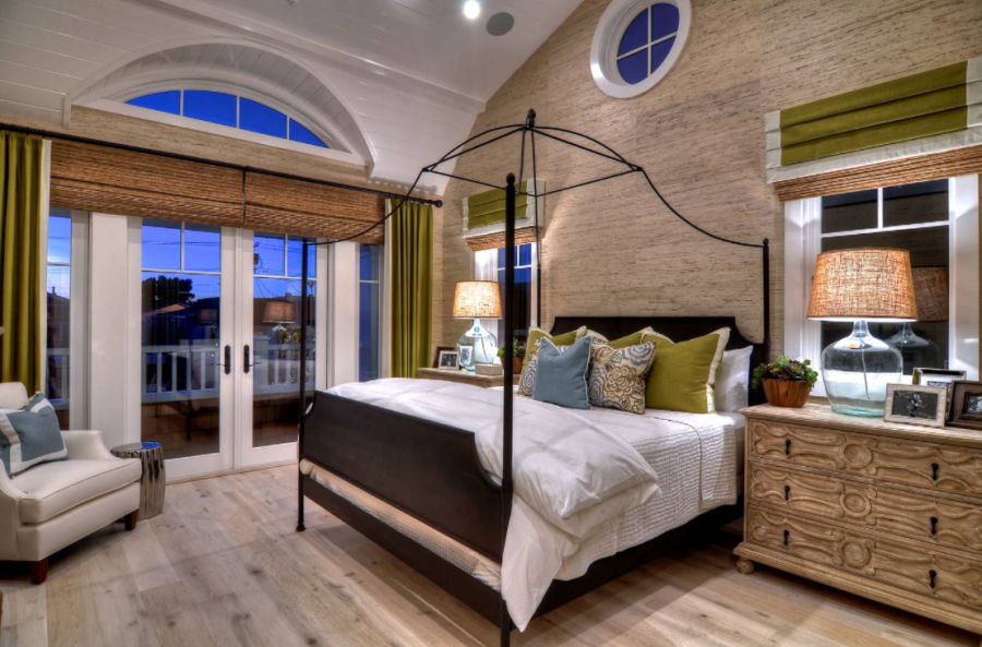 Example of a large trendy master light wood floor and brown floor bedroom design